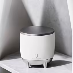 an image of a modern speaker sitting on the shelf