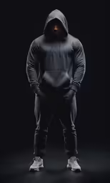man in black hoodie and pants standing up