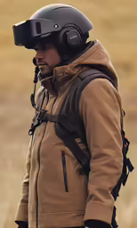 a person wearing headphones while standing in a field