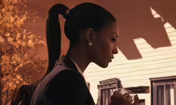 a girl in profile and holding a coffee mug