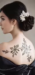 woman with flower tattoo on back