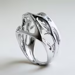 silver and white gold wedding band that features swirls