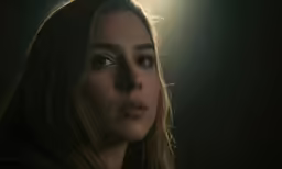 the woman with blonde hair is staring into the camera