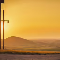 a lamp post sitting on the side of a road