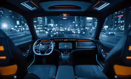 the interior of a vehicle with a steering wheel, dashboard and touch screen displays