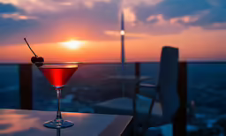 a close up of a martini glass on top of a table
