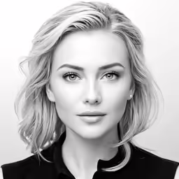 a black and white photo of a woman with blonde hair