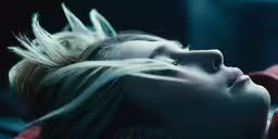 a woman that is laying down with her head down