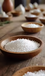 a close up of white rice on a wooden table