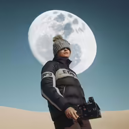 the man is taking pictures of the moon