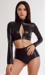 a woman wearing black leather is posing for the camera