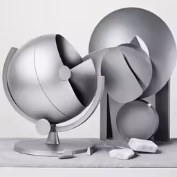 a sculpture is shown with objects laying around it