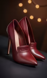 a pair of red high heels with a light in the background