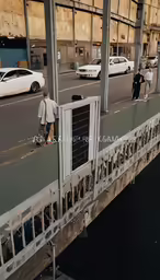a person on a skateboard and a couple of cars