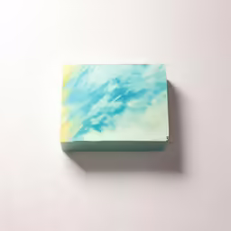a white, blue and yellow marble block with white clouds