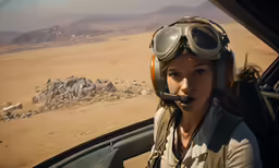 a person sitting in a plane with a sky background