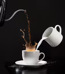a coffee maker pouring liquid into a white cup