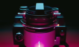 a camera with pink lights on a black background