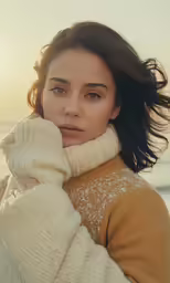 a close up of a woman wearing a sweater