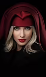 a woman in red with long blonde hair wearing a headscarf