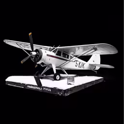 a small plane is displayed on a stand