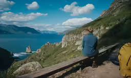 a woman with long hair is sitting on a bench