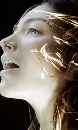 a woman with her hair blowing in the wind