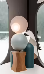 three balls of different sizes sitting on top of a table