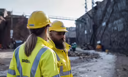 an urban scene with a construction man and a woman standing together