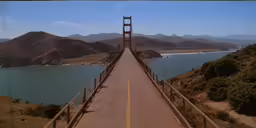 a road runs through a large bridge with water on both sides