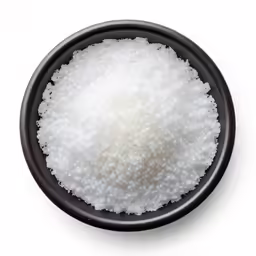 a bowl of salt or powder on white background