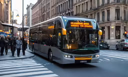 city bus driving down a busy city street