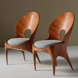 two wooden chairs are pictured next to each other