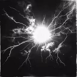 a black and white photo of lightning striking in the dark