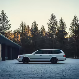the back end of a white limo parked in a parking lot