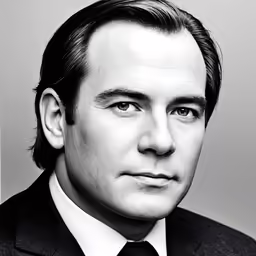 black and white portrait of a man in suit and tie