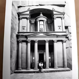a couple of people are standing outside of a building