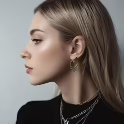 young woman with jewelry set in studio shot