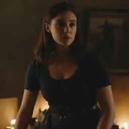 a woman standing next to another woman and candles