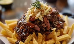 a very large pile of delicious looking food on a table