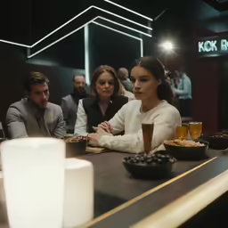 two women and two men sit together at a bar