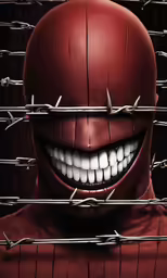 a man with teeth and spikes in front of barbed wire
