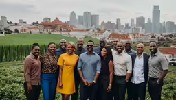 a group of people standing together in a city