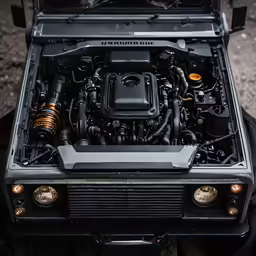 a car has a large engine and lights