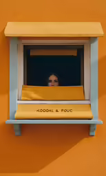 an image of a woman peeking out of the window