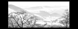 black and white photograph of the mountainous mountains in the background