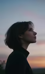 a person with her head looking up into the sky