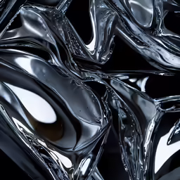 a glass sculpture with wavy shapes on top