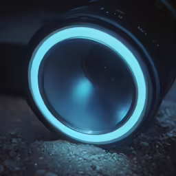 a close up of a speaker with bright light on