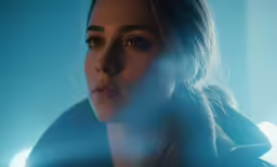 a close - up of a woman staring at the camera